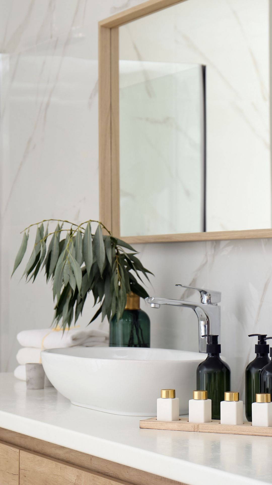 MonsterSales Cabinetry Bathroom Faucet Photo in a white and light-wood-colored bathroom.